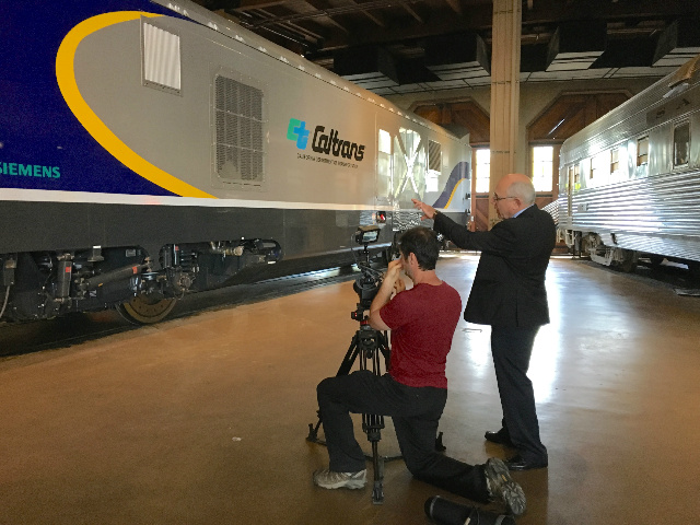 Dave Ward of Siemens directs our cameraman taking videos of the new locomotive.