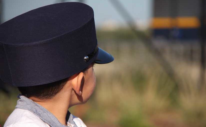 Boy looking at train