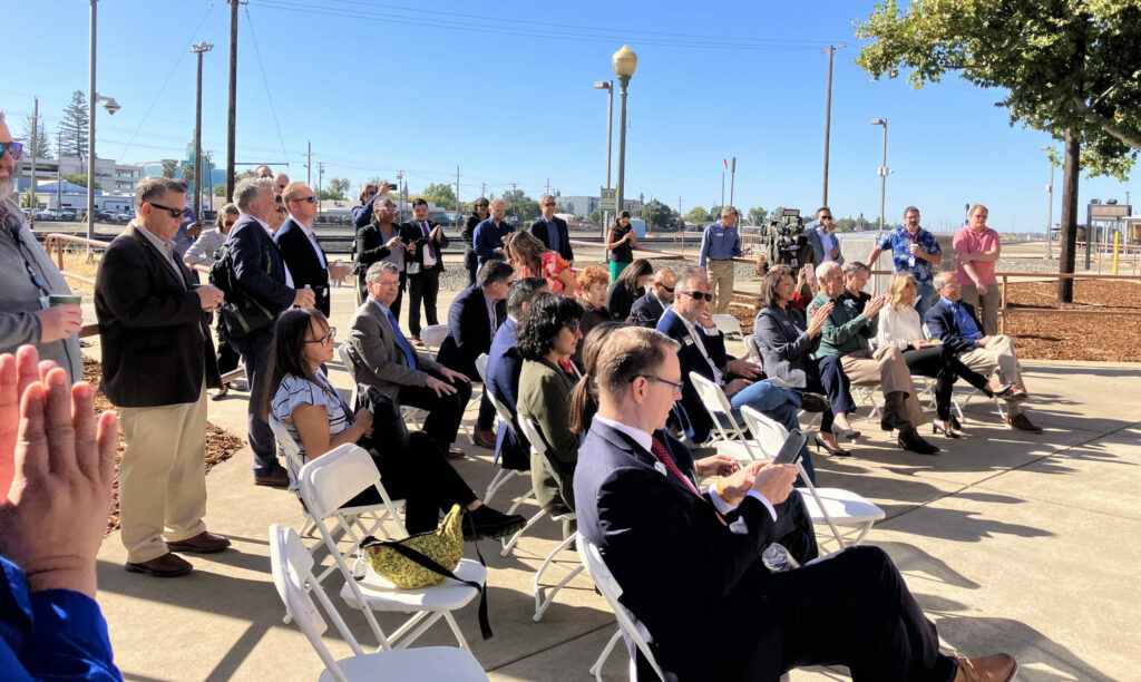 Attendees sitting at train station