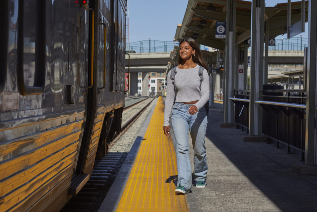 Girl boarding train on platform